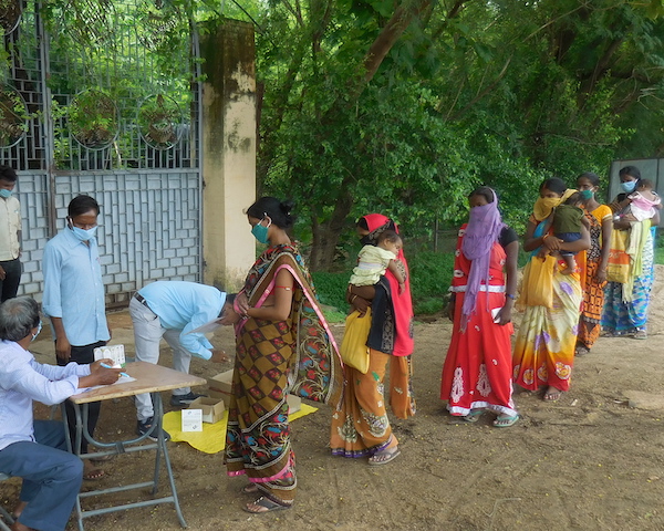 Women line up for check up